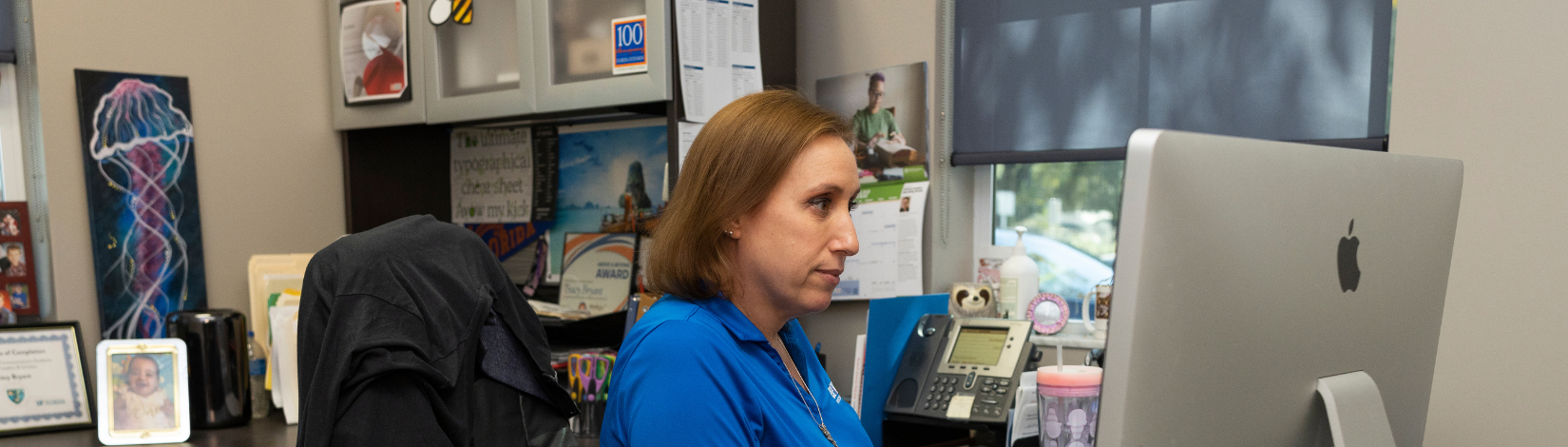 UF/IFAS Director of Creative Services Tracy Bryant at her desk.