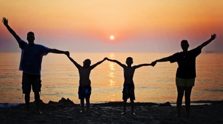 Family watching sunset