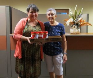 Yvonne accepts 2nd donation of peanut butter from Myra Greenfield