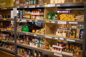 nonperishable food items on wooden shelves