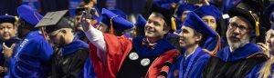 Dr. Lorenzo Rossi attends UF graduation with a student he mentored