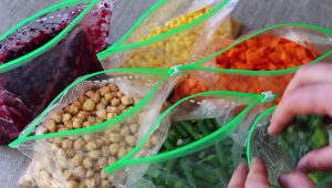 ziploc bags filled with vegetables ready for freezing