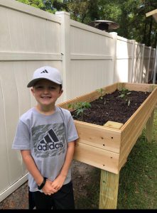 Lafayette 4-H member Easton Powers with his raised bed garden