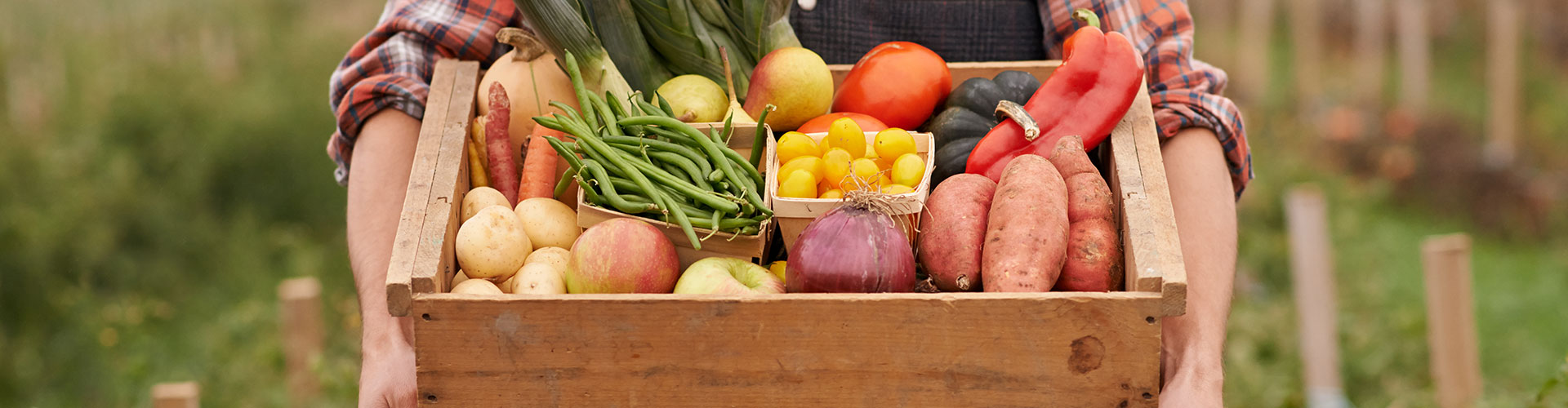 wooden crate full of vegetables and fruit