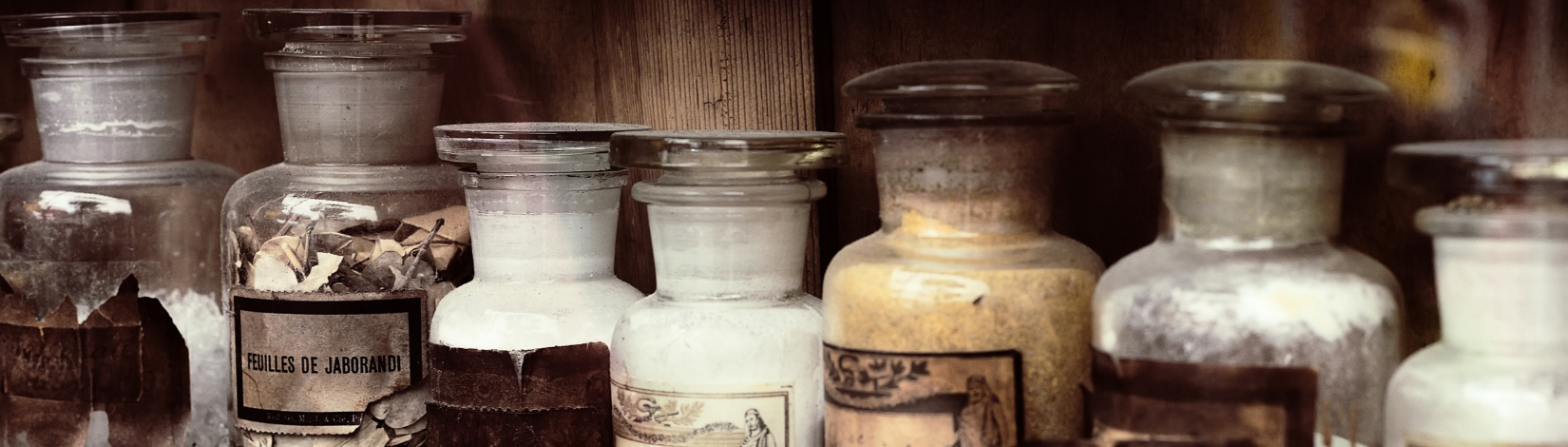 image of old pharmacy glass bottles