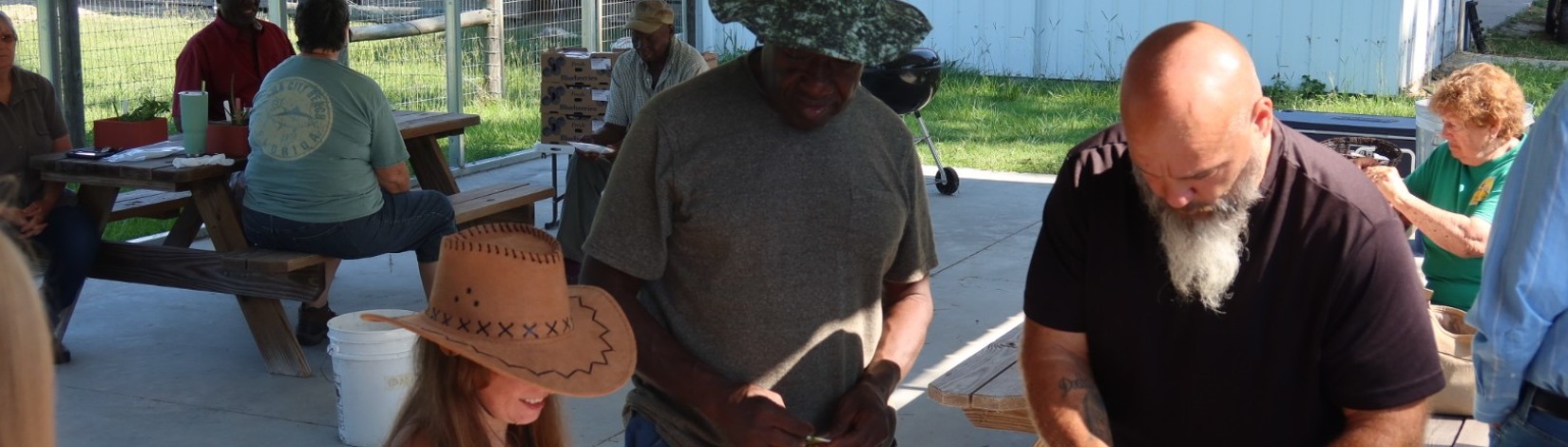 people of different ages, gender, ethnicity and races gather to learn gardening skills