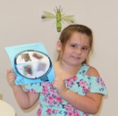 girl holding butterfly pictures