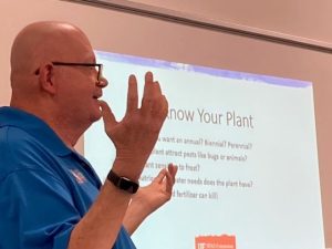 man emphasizing a point with raised hands