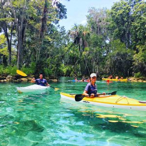 interns Alec and Kimberly kayaking in Three Sisters Springs