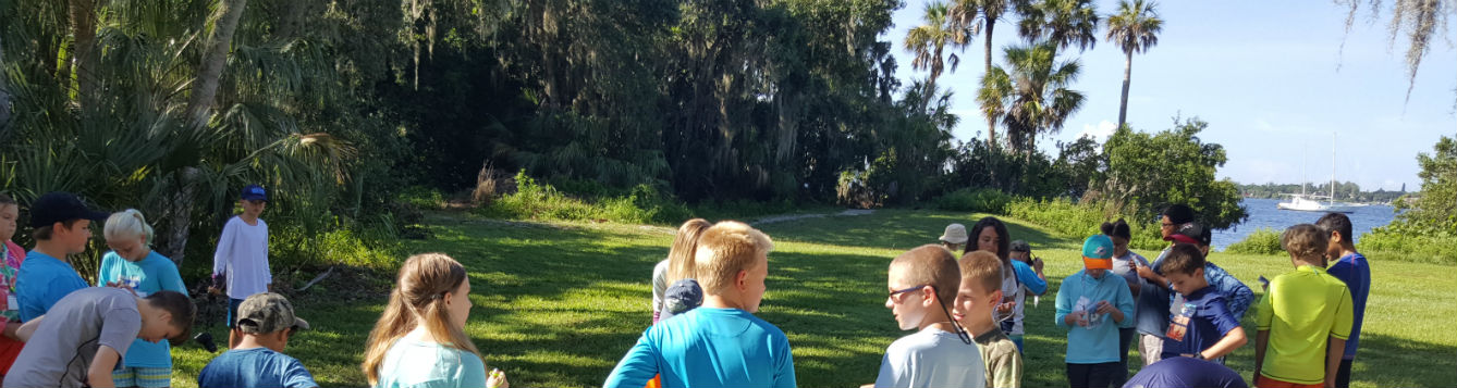 kids working with cast net on waterfront
