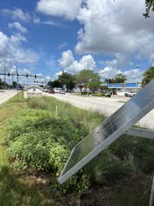 Solar panels are shown in the median landscaping.