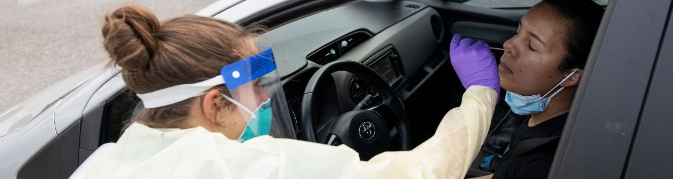 person getting tested for COVID-19 during drive-up testing