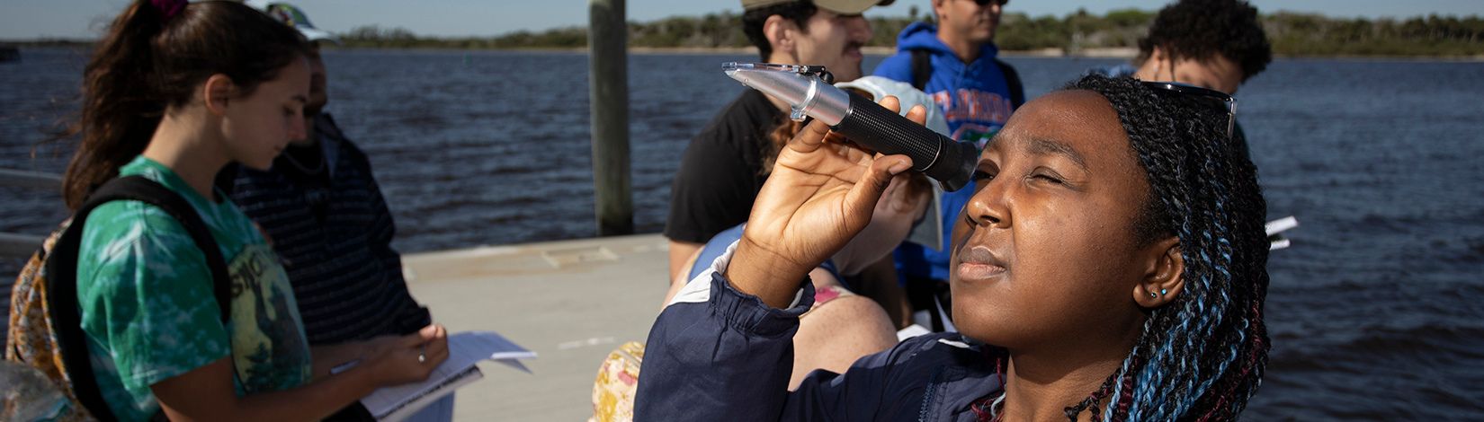 Students learning to use water sampling devices.