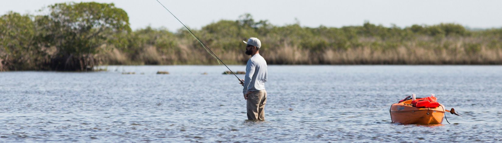A fisherman in shallow waters in the Gulf of Mexico.