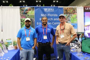 Graduate student Mohammed Kyum, postdoc Yuvraj Khamare and farm supervisor Jack Morrison at MREC's booth at the Landscape Show.