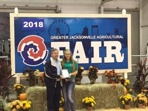 Kinley receiving her award