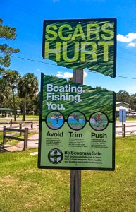 scars hurt boat ramp sign