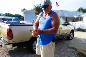 Cedar Key Bird Rescue lead volunteer Capt. Doug Maple rescuing a least bittern in Cedar Key.