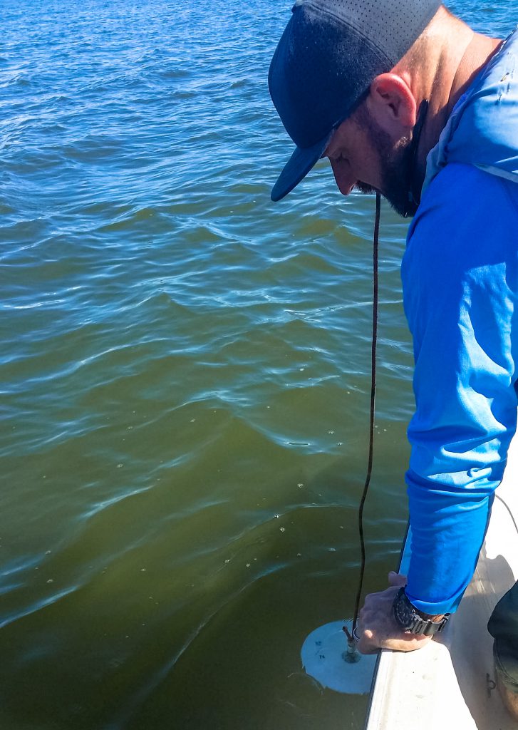 Water Watch Volunteer James Custer measuring secchi depth