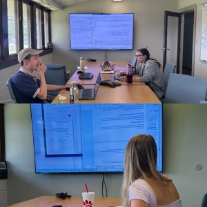 Amelia and SRWMD staff collaborating on data analysis. 