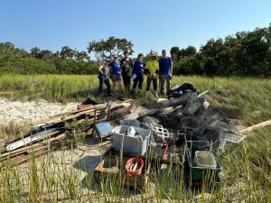 UF group pulls in a haul of trash from the canal by Joe Rains beach. 
