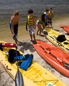 image - kids learning to kayak is another great idea summer fun on the cheap. Some parks rent them free to students with an ID.