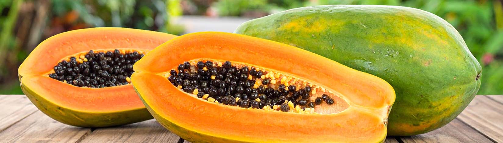 Photo of papaya open on a table.