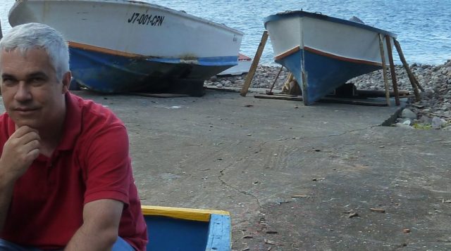 UF Distinguished Professor Kai Lorenzen sits on a boat in Dominica. Photo: Courtesy UF/IFAS