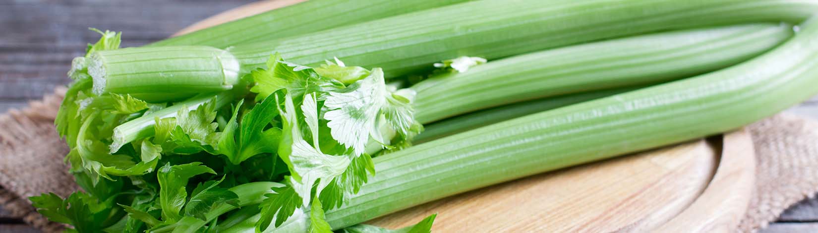 a stalk of lettuce on a cutting board. An Adobe stock image.