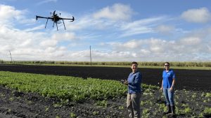 Xavier with Larissa Carvalho Ferreira, a postdoctoral research associate on the team, implements the drone-assisted monitoring system with real-time weather data to develop an AI-powered tool for targeted fungicide applications.