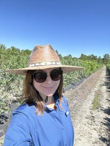 UF/IFAS plant breeding Ph.D. graduate in a field. courtesy, Estefania Flores.