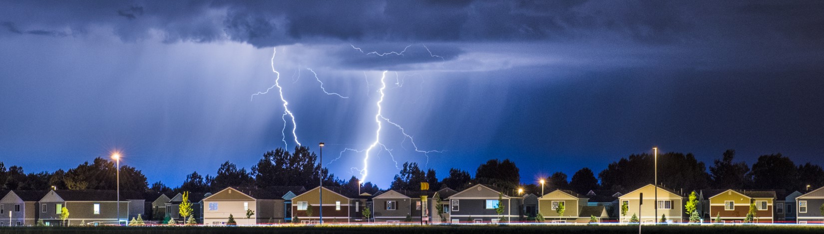 Lightning bolts above urban skyline