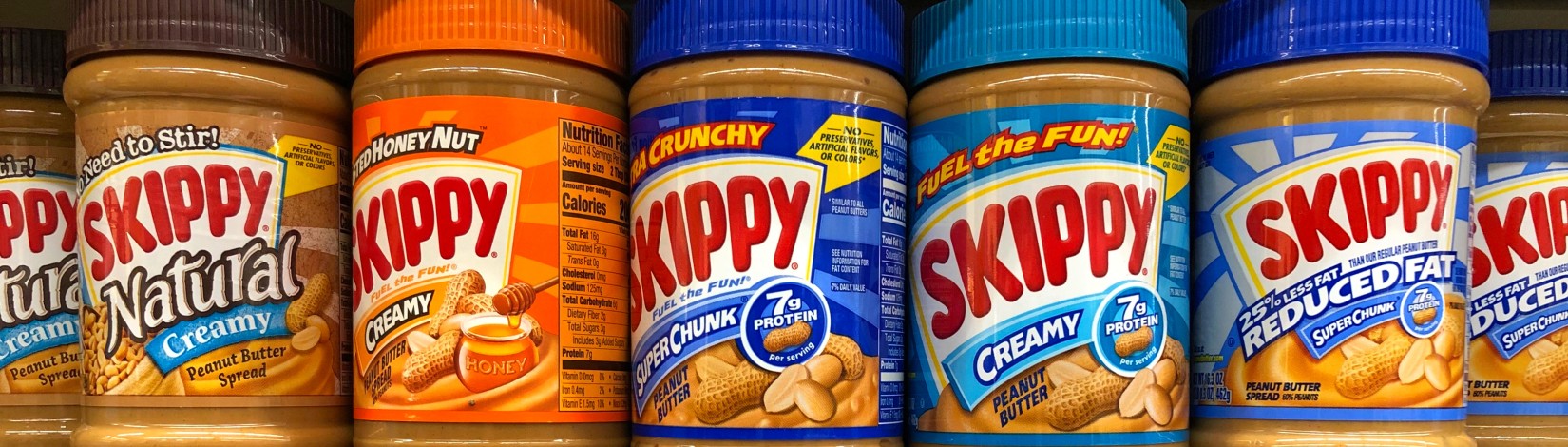 Jars of colorful peanut butter