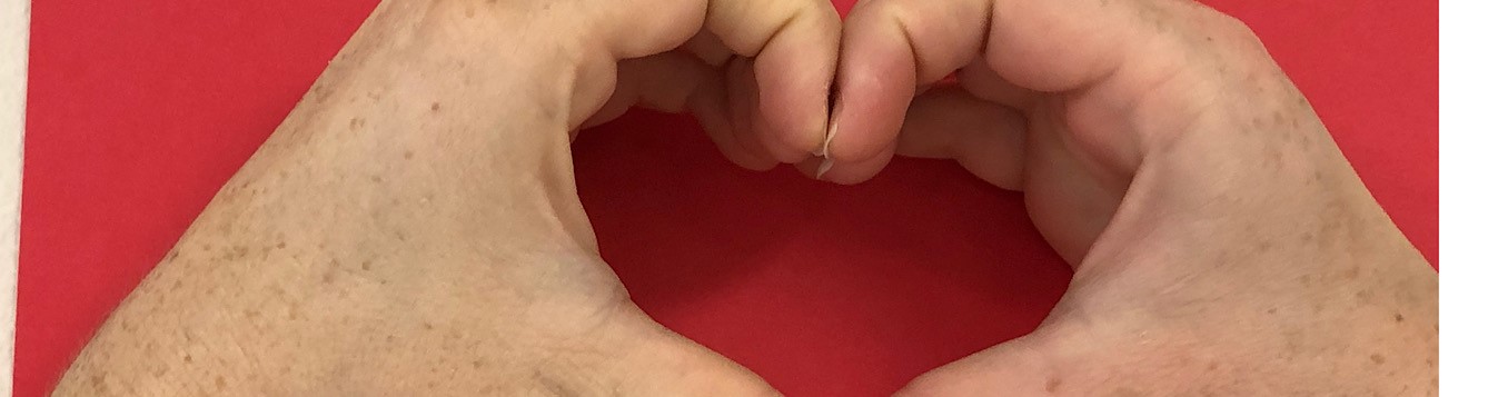 two hands making a heart