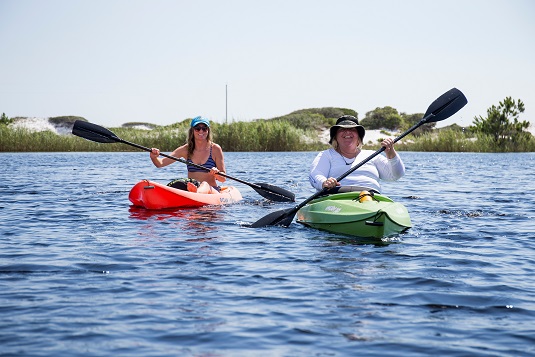 kayakers in a dune lake