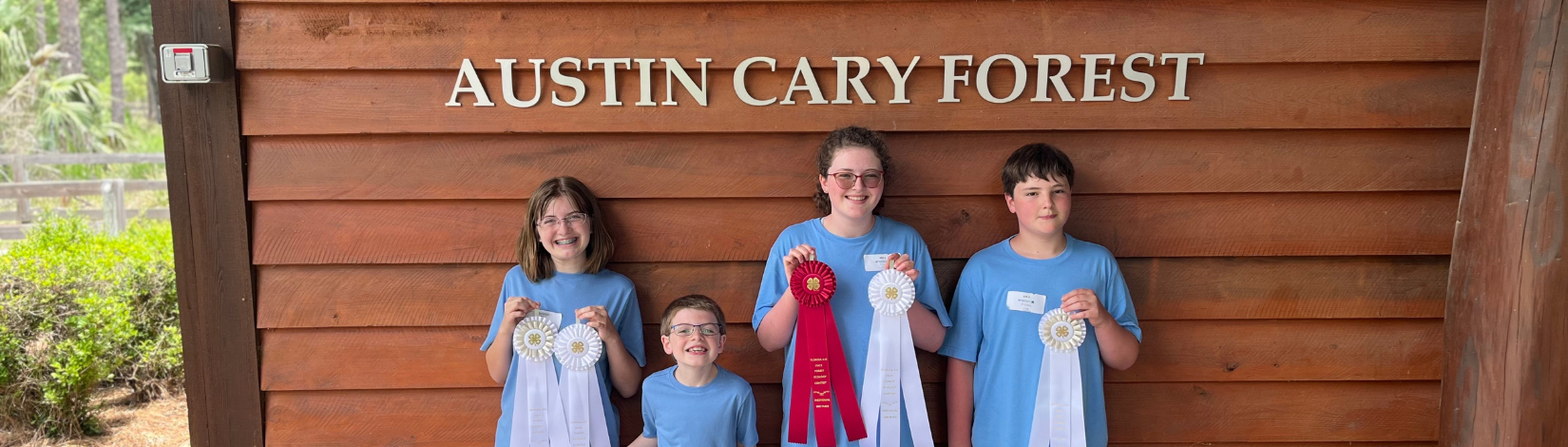 Photo of youth standing outside the Austin Cary Learning Center for the 2025 Florida 4-H Forest Ecology Contest.