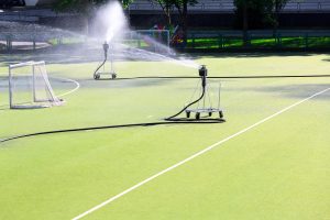 Sprinkler watering a artificial grass soccer field