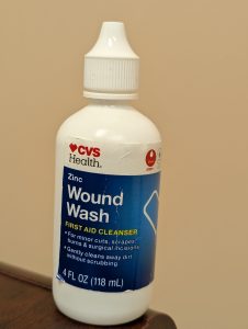 A sterile solution in a squeeze bottle can help irrigate any foreign debris