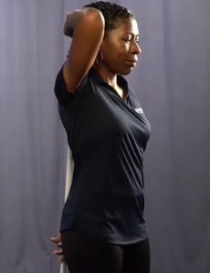 A demonstrator shows how to start the hip hinge.