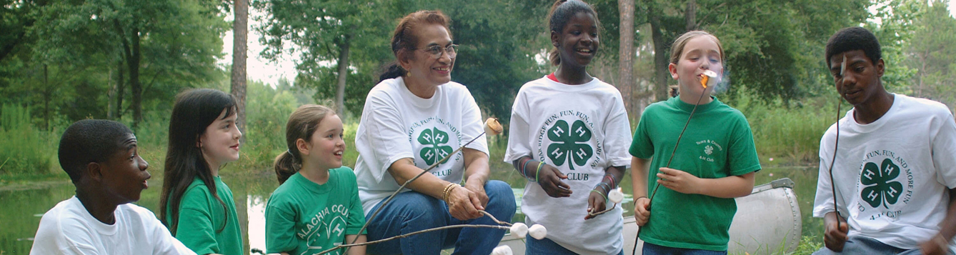 4-H youth at campfire
