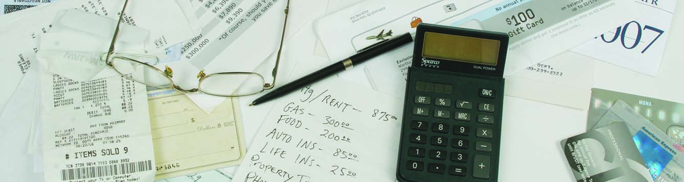 bills, credit cards, glasses, calculator