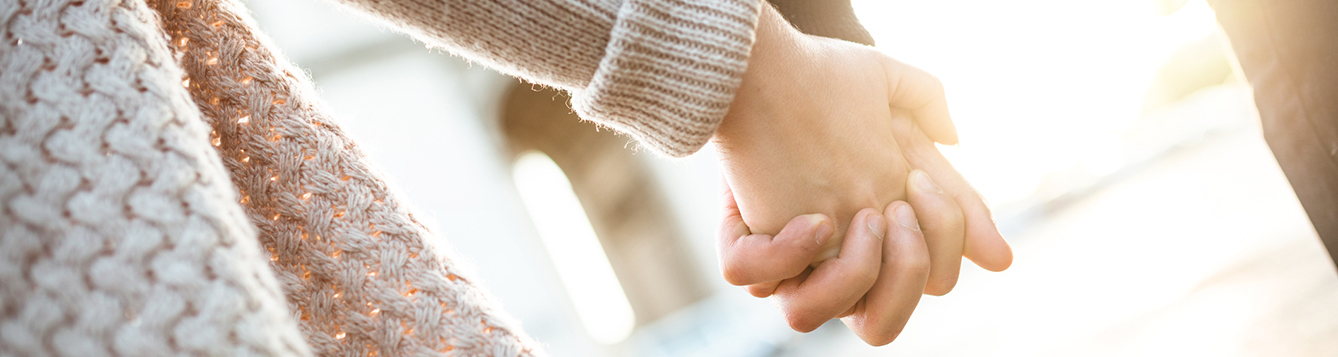 Couple holding hands
