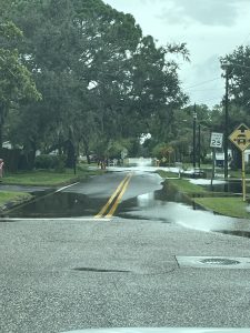 flooded road with standing water 