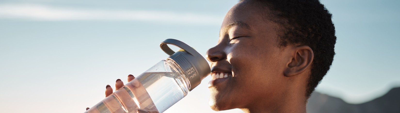 Water, relax and black woman training in nature, happy hiking and fitness progress in Taiwan. Hydration, thirsty and African runner with a drink after sports exercise, running and morning workout.