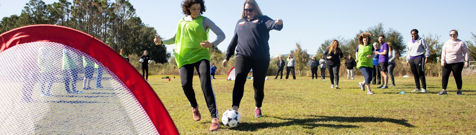 Food Nutrition Program personnel participating in the Soccer for Success program.