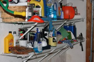 picture of chemicals on a shelf over a washing machine