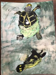 Child's painting of two turtles swimming in the ocean 