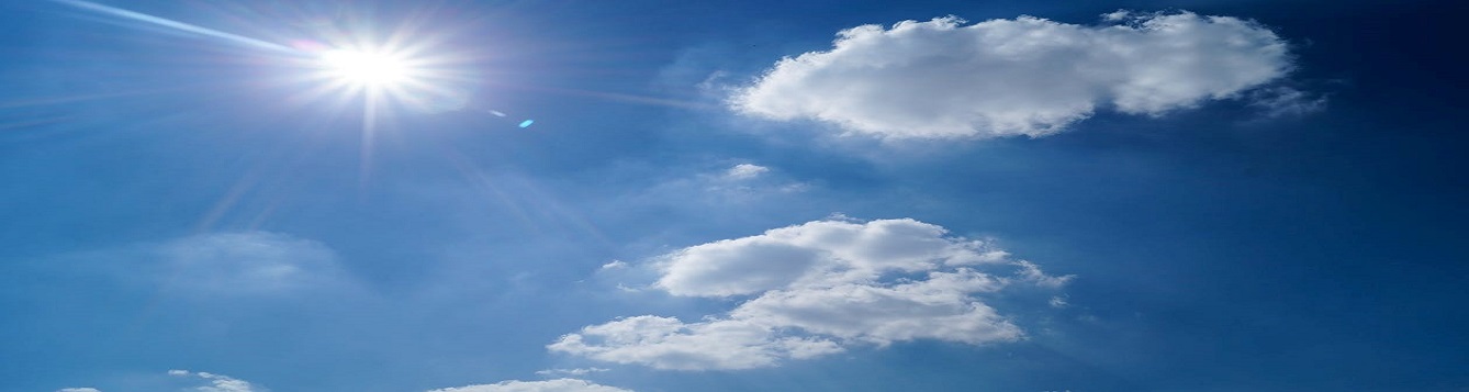 Sun shining with partly cloudy, but blue skies