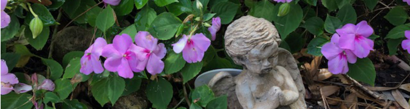 relaxing purple flowers and statue in the garden