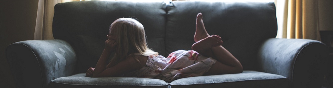 kid lying on the couch
